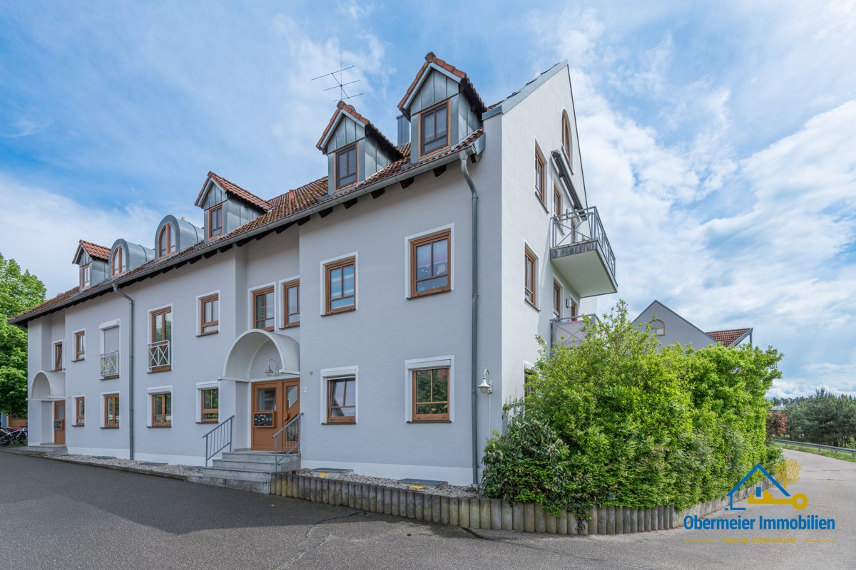 Foto ETW mit Westbalkon, Gemeinschaftsgarten & TG